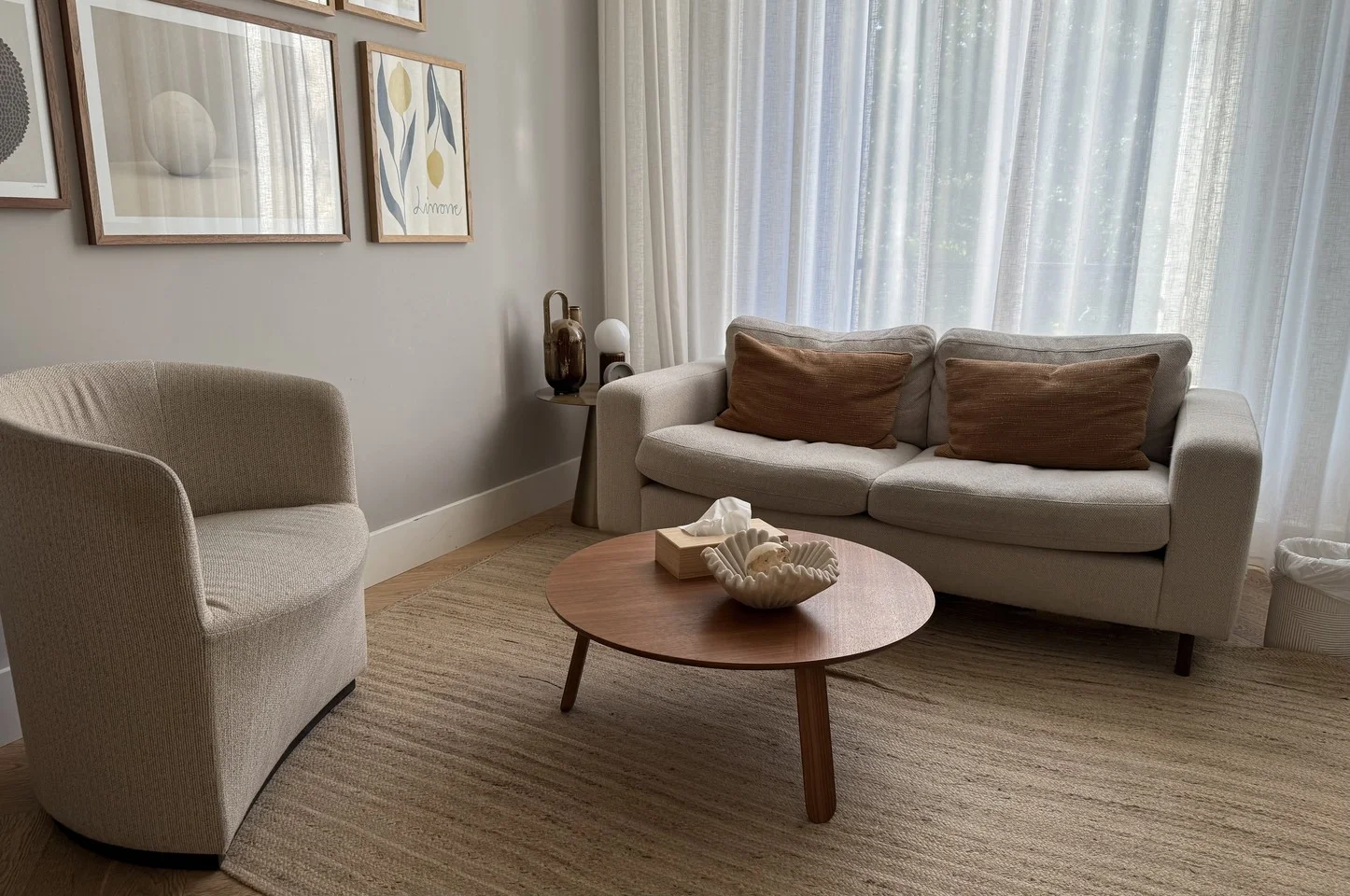 The Ontara Therapy studio in Amsterdam — a modern, calm consultation room with armchairs, sofa, and natural light