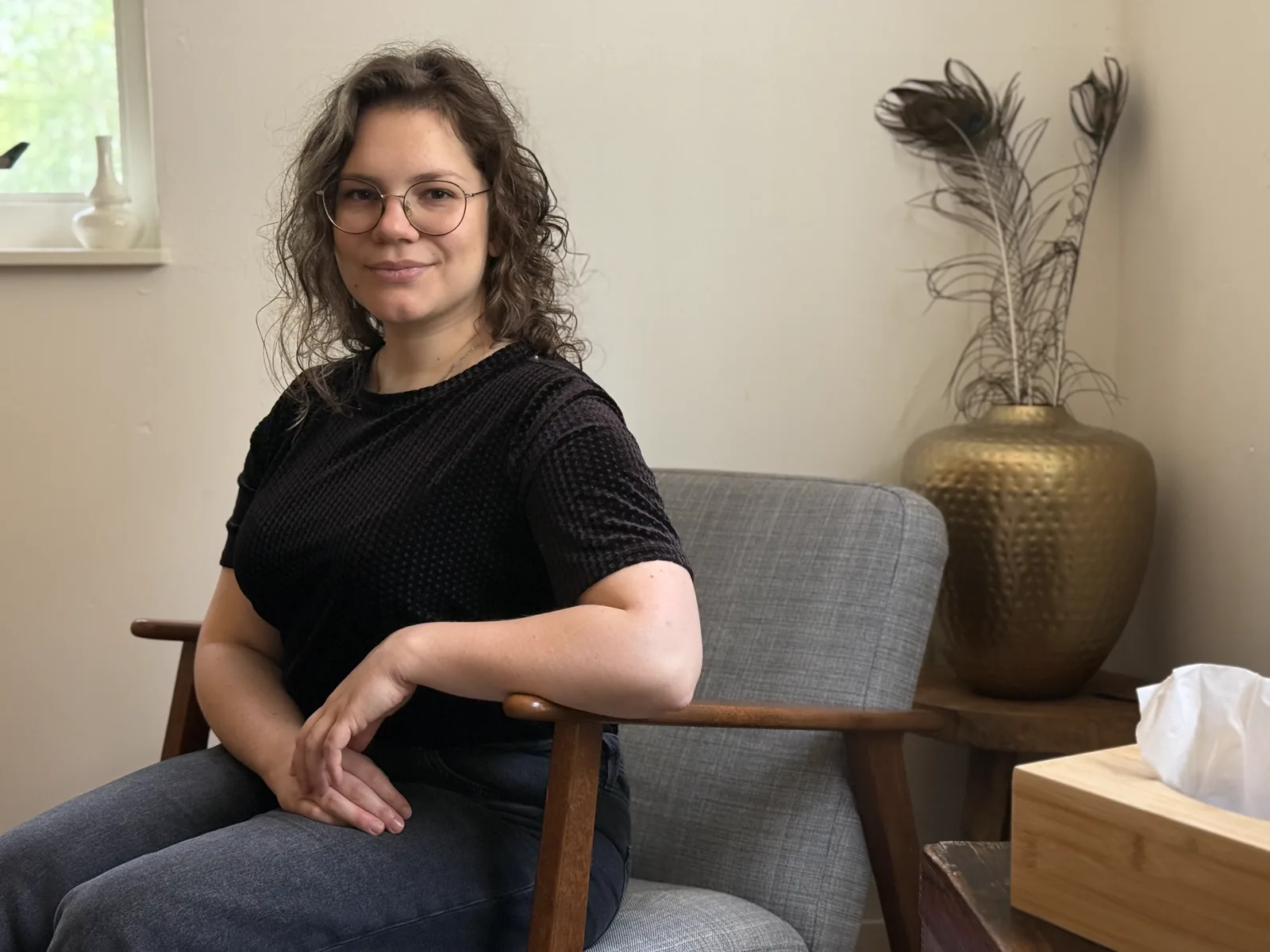 Eva Virc seated in her Leiden therapy studio